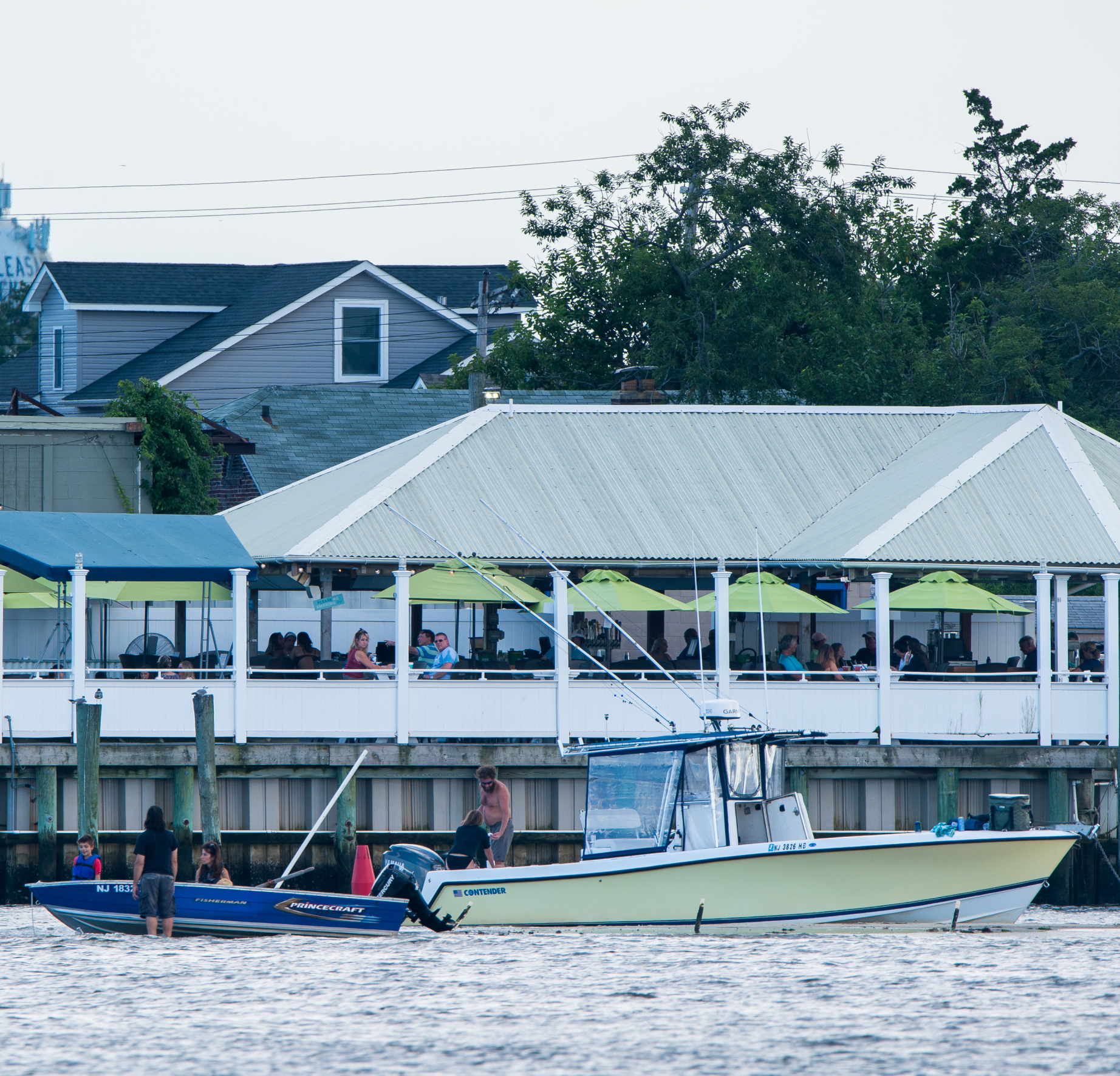Coastal scene with a boat and a building